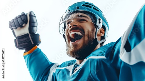 The Roar of Victory: Ecstatic hockey player in blue jersey, helmet, and gloves celebrates a triumphant moment with unbridled joy.  photo