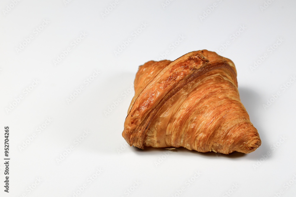 Freshly baked croissant, Brown crispy croissants isolated on white background. French pastry closeup photo. Buttered bread croissant isolated on white background. Freshly baked croissant, Brown crispy croissants isolated on white background. French pastry closeup photo. Buttered bread croissant isolated on white background.