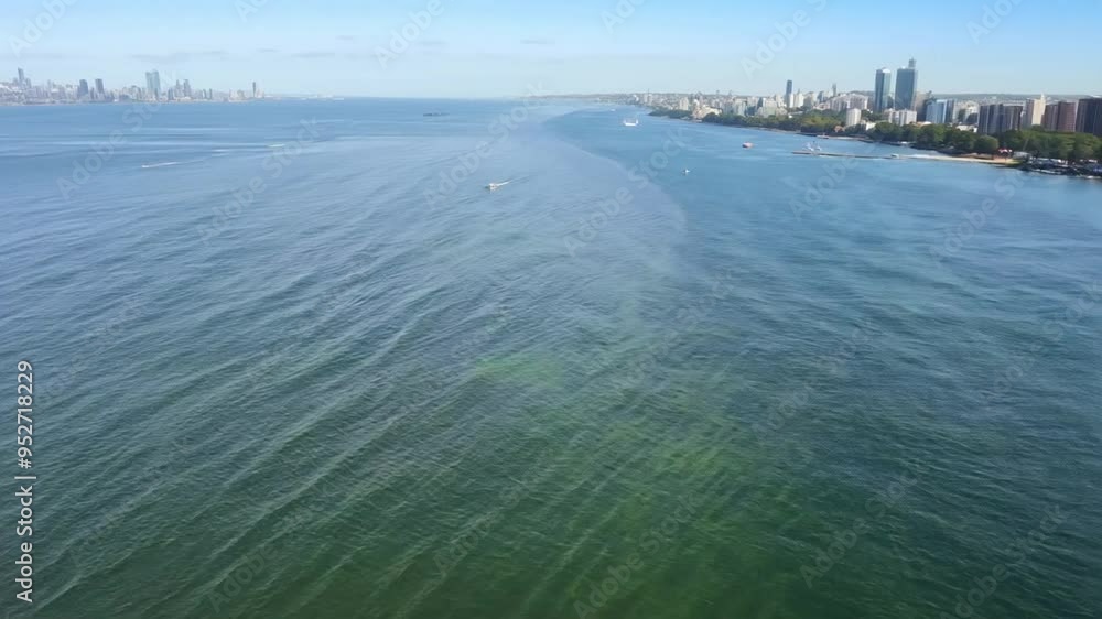 Serene Coastal View of the Clear Waters and City Skyline in Daylight Generative AI