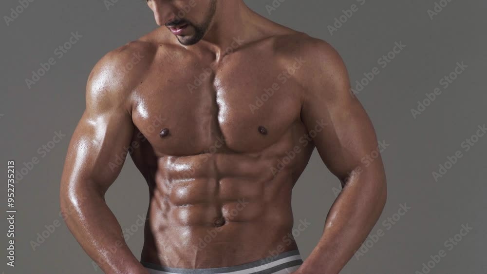Sport Sexy Fit man showing perfect muscular ripped abs. Male Fitness model. Six pack or Ab. Perfect abs, shoulders, and chest. Close up the Abs. Closeup torso. Muscular torso and ripped abs. Sport Sexy Fit man showing perfect muscular ripped abs. Male Fitness model. Six pack or Ab. Perfect abs, shoulders, and chest. Close up the Abs. Closeup torso. Muscular torso and ripped abs.