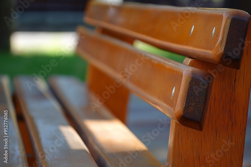 Detailed view of a polished wooden bench with bolts, showing craftsmanship and inviting an atmosphere of relaxation.