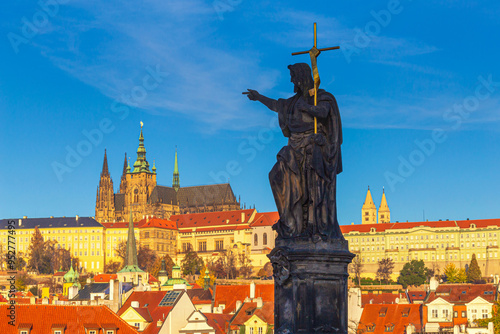Obraz na płótnie Cityscape - view of the sculpture of St. John the Baptist on Charles Bridge with Prague Castle in the background, Czech Republic w salonie