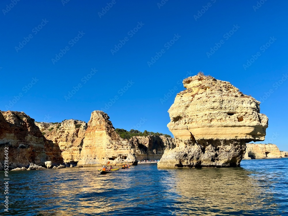 Oddly shaped jagged rock formations and cliffs at Lagoa Beach, Faro District, Southern Portugal. Oddly shaped jagged rock formations and cliffs at Lagoa Beach, Faro District, Southern Portugal.