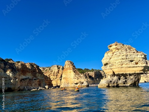 Oddly shaped jagged rock formations and cliffs at Lagoa Beach, Faro District, Southern Portugal.