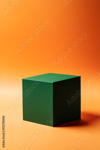 A striking green cube stands prominently against an orange backdrop, creating a captivating visual for product displays. The arrangement emphasizes empty space and color contrast