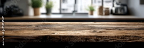 A rustic wooden table takes center stage with its natural texture, set against a softly blurred modern kitchen, creating an inviting and cozy ambiance photo