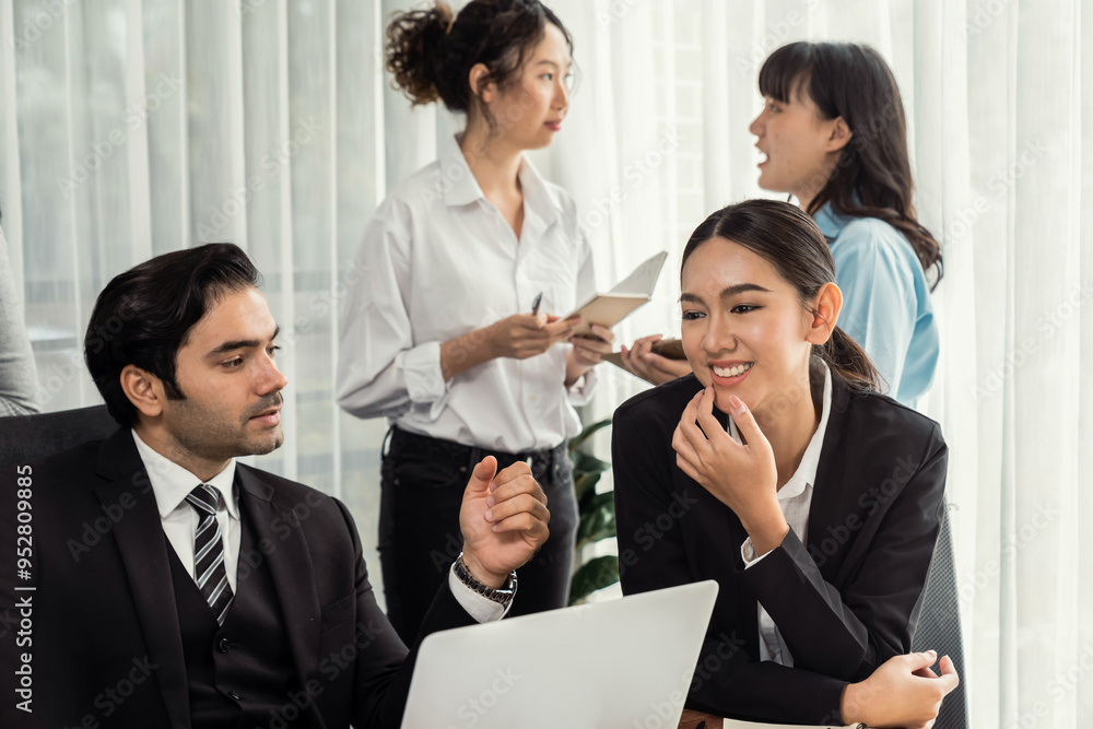 Diverse of business people from various ethnic group working in modern office environment. Productive and multi ethnic office workers engage in discussion for strategic business marketing. Meticulous Diverse of business people from various ethnic group working in modern office environment. Productive and multi ethnic office workers engage in discussion for strategic business marketing. Meticulous