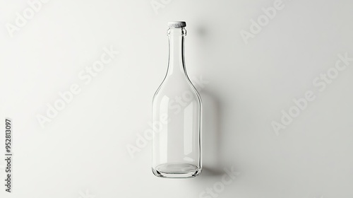 A clear glass bottle stands upright against a plain background, showcasing its simplicity.