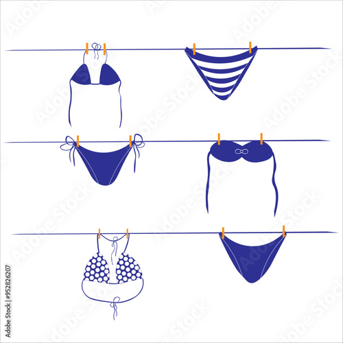 blue bathing suits hanging on a rope. different designs and patterns. summer vacation