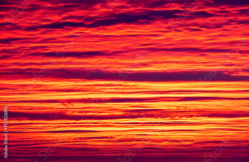 Fiery Flames Drowning in Volcanic Hues of the Evening Sky photo