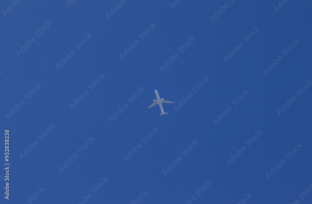 blue sky and a distant white airplane, airplane from below, bright blue sky and airplane, airplane from far away, plane in the sky blue sky and a distant white airplane, airplane from below, bright blue sky and airplane, airplane from far away, plane in the sky