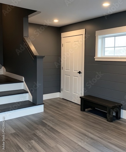 a modern farmhouse style foyer with gray LVP flooring. The walls are also painted gray. --chaos 20 --ar 4:3 --style raw --v 6.1 Job ID: dbb37aa9-231b-47d7-9874-6c61df8eab8d