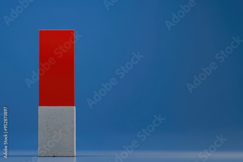 Modern Minimalist Red Concrete Block with Blue Background photo