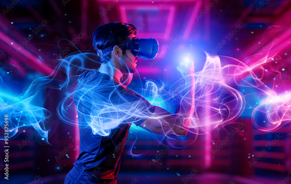 Man wearing VR glass and smashing or punching at camera in neon boxing arena. Sport gamer boxing and moving gesture in metaverse or virtual world while using digital technology innovation. Deviation. Man wearing VR glass and smashing or punching at camera in neon boxing arena. Sport gamer boxing and moving gesture in metaverse or virtual world while using digital technology innovation. Deviation.