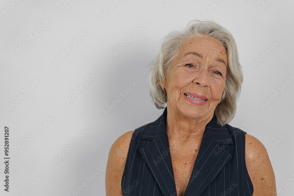 A charming portrait of a senior woman radiating warmth and confidence in a stylish outfit that enhances her beauty A charming portrait of a senior woman radiating warmth and confidence in a stylish outfit that enhances her beauty