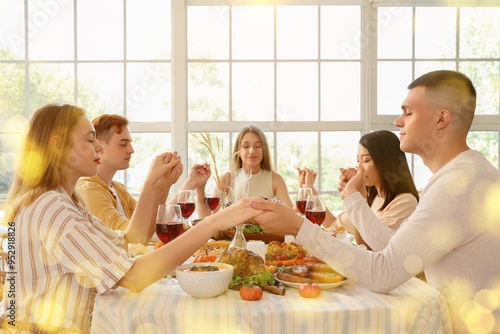 People praying before dinne...
