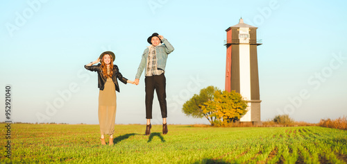 Happy young couple jumping ...