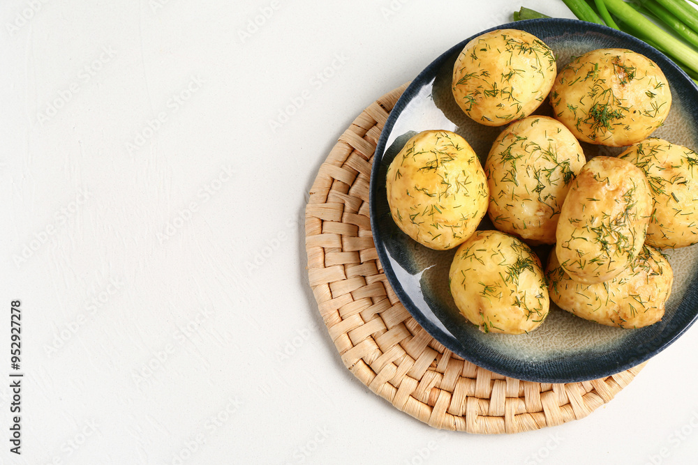 Plate of boiled baby potatoes with dill and green onion on white background Plate of boiled baby potatoes with dill and green onion on white background