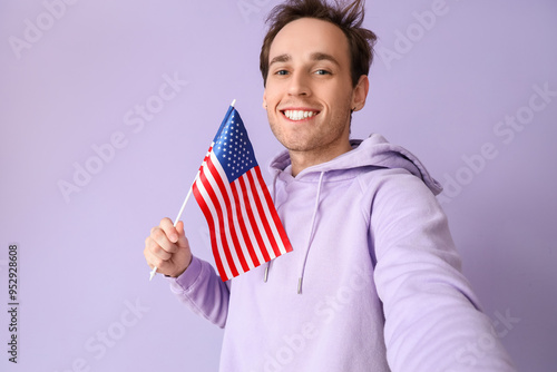 Young man with USA flag tak...