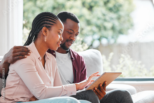 People, black couple and smile with tablet on sofa at home with browsing internet for house insurance options. Family, relationship and happy or satisfied on website for life policy and funeral cover