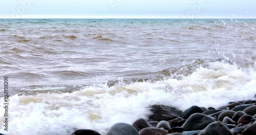 Waves and splashes on the rocks at the North Shore of Lake Superior in Minnesota. photo