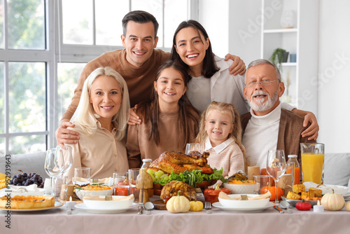 Happy family having dinner ...
