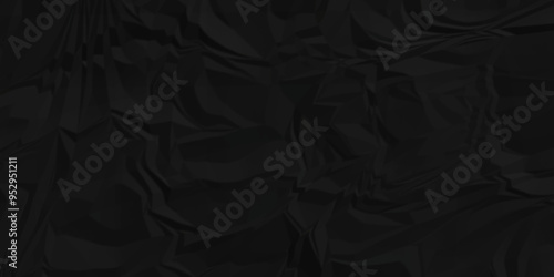 Texture of dark black crumpled wrinkle chaotic paper. old crumple black paper sheet abstract shape background space for text.