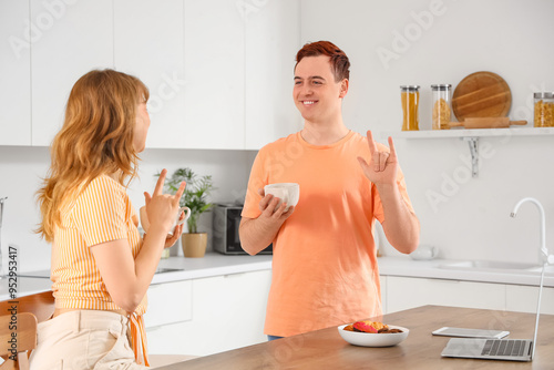Young deaf mute couple with...