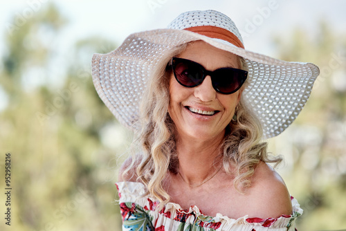 Vászonkép Fashion, portrait and sunhat with happy old woman outdoor for holiday, travel or vacation