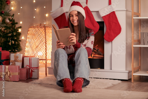 Young happy woman in Santa ...