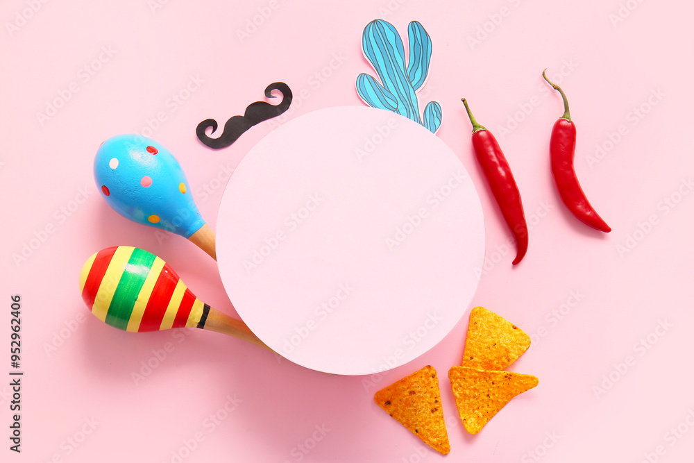 Composition with blank card, Mexican maracas, nachos chili peppers on pink background. El Dia de Muertos Composition with blank card, Mexican maracas, nachos chili peppers on pink background. El Dia de Muertos