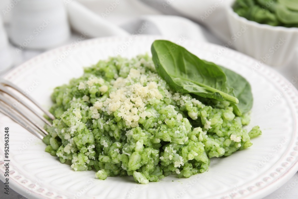 Tasty spinach risotto served on table, closeup Tasty spinach risotto served on table, closeup