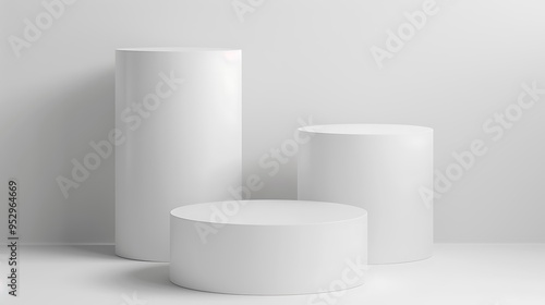 A minimalist display featuring three white cylindrical podiums on a light background.