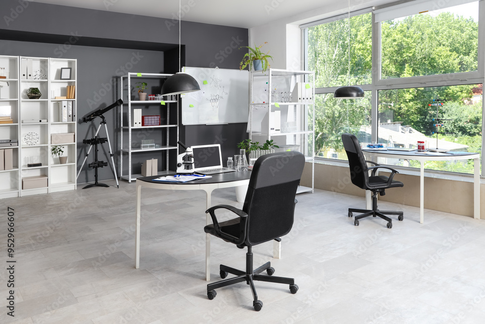 Fototapeta premium Modern office interior with scientific equipment and collaborative workspace