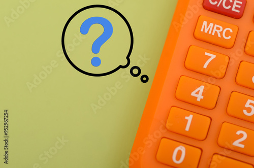 a calculator juxtaposed with a question mark, symbolizing the uncertainty and confusion often associated with complex calculations or problem-solving. photo