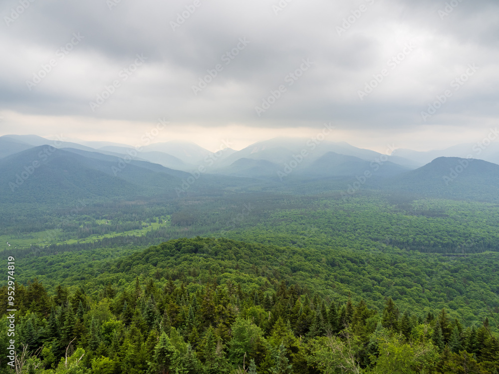 View from summit of Mt. Van Hoevenberg with haze over Adirondack Mountains wilderness, outside Lake Placid, New York State. View from summit of Mt. Van Hoevenberg with haze over Adirondack Mountains wilderness, outside Lake Placid, New York State.