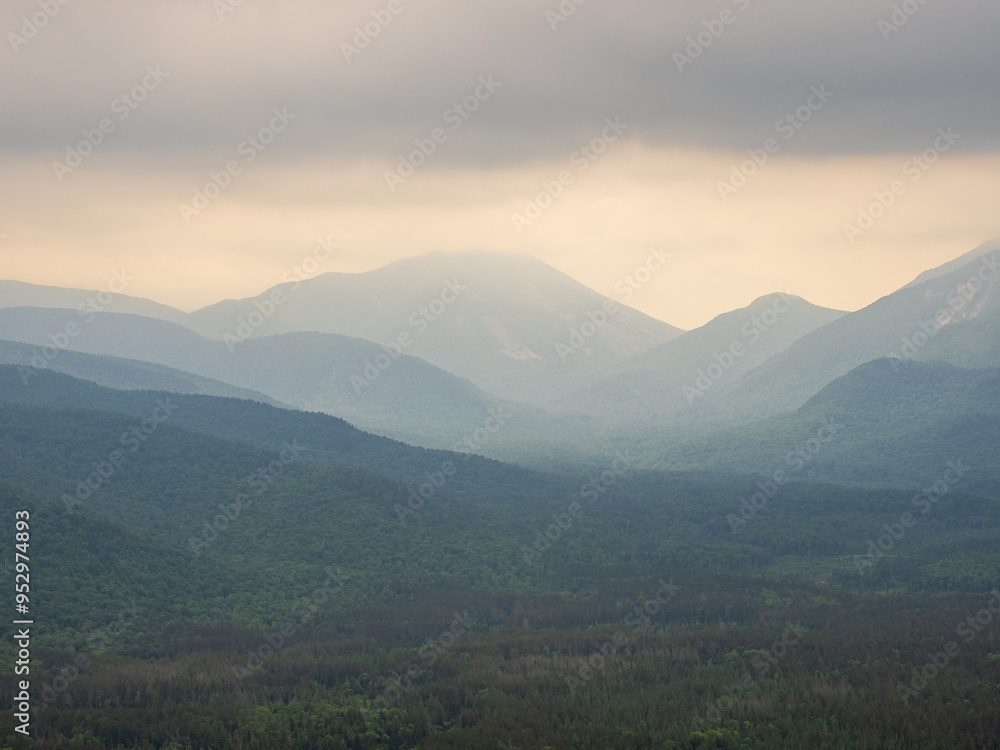 Obraz premium Adirondack Mountains layered in haze viewed from the summit of Mt. Van Hoevenberg, outside Lake Placid, New York State.
