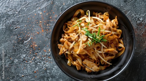 Stir-fried rice noodles with soy sauce and pork photo