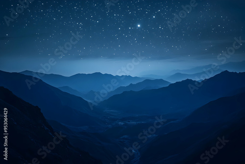 A mesmerizing night sky with a blanket of stars over a vast mountain range.