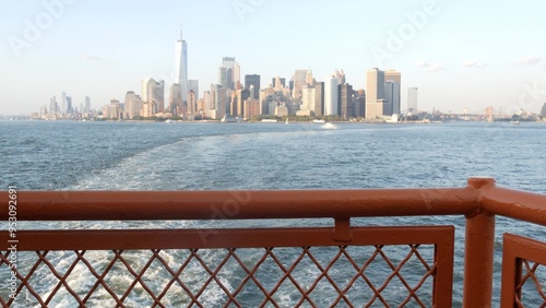 New York City skyline from ferry boat to Staten Island. Manhattan downtown. World Trade Center skyscraper from ferryboat. River waterfront sunset panorama, riverfront buildings architecture, FiDi, USA