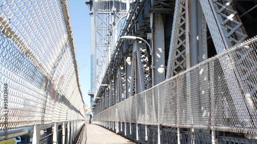 Obraz premium Manhattan Bridge to Brooklyn Dumbo. New York City symbol, USA travel destination. Architecture of United States, tourist landmark. Cable-stayed bridge. Pedestrian path perspective.