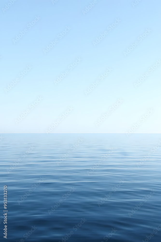 Fototapeta premium A serene view of calm water with gentle ripples, reflecting a soft blue hue. The surface appears smooth and tranquil, creating a peaceful atmosphere.