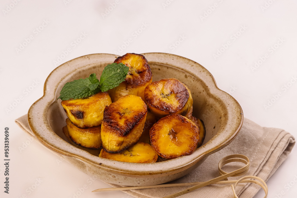 Platanos Maduros or Fried Sweet Plantain is a Side Dish in Latin and Caribbean Snack. Platanos Maduros or Fried Sweet Plantain is a Side Dish in Latin and Caribbean Snack.