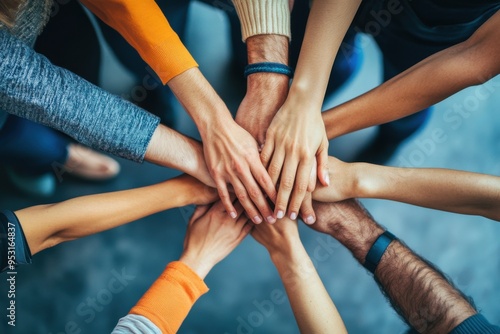 Hands of diverse group of people joined together, unity and teamwork concept 