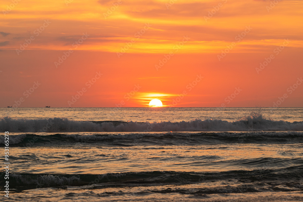 Vibrant Ocean Sunset. A stunning sunset over the ocean with vibrant orange and yellow hues casting a warm glow across the water as the sun dips below the horizon. yellow clouds in red sky background Vibrant Ocean Sunset. A stunning sunset over the ocean with vibrant orange and yellow hues casting a warm glow across the water as the sun dips below the horizon. yellow clouds in red sky background