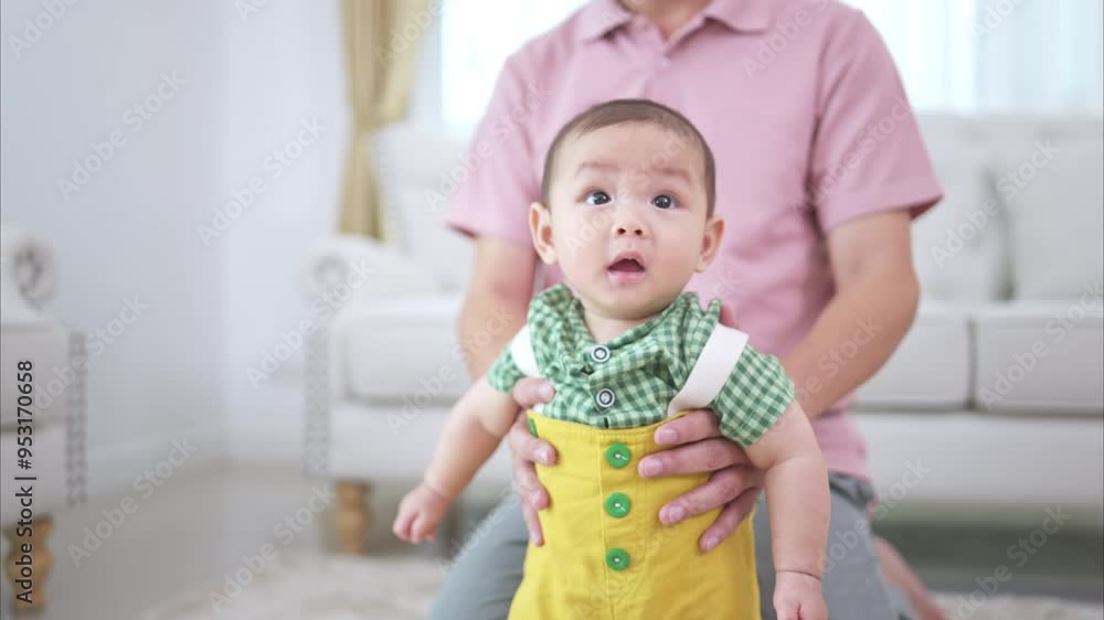Father and their little child play happily in the living room of the house Father and their little child play happily in the living room of the house