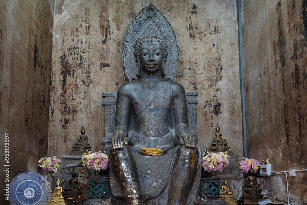 Interior view inside Wihan Phra Khanthararat temple, serene Buddha statue seated in a meditative pose, gandhara, inside a historic temple in Phra Nakhon Si Ayutthaya, Thailand. Interior view inside Wihan Phra Khanthararat temple, serene Buddha statue seated in a meditative pose, gandhara, inside a historic temple in Phra Nakhon Si Ayutthaya, Thailand.
