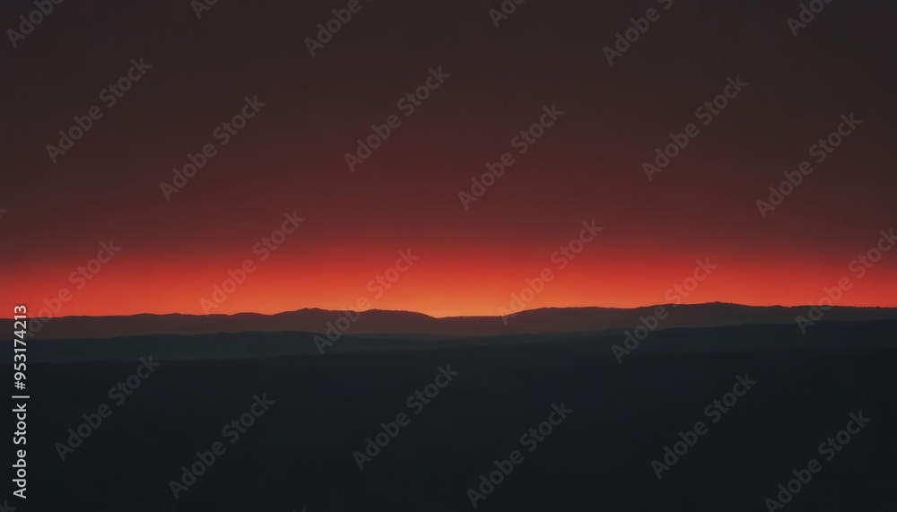 A dramatic red sunset over a mountain range. A dramatic red sunset over a mountain range.