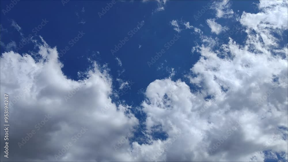 Multiple cirrocumulus clouds moving across the sky in the afternoon Multiple cirrocumulus clouds moving across the sky in the afternoon