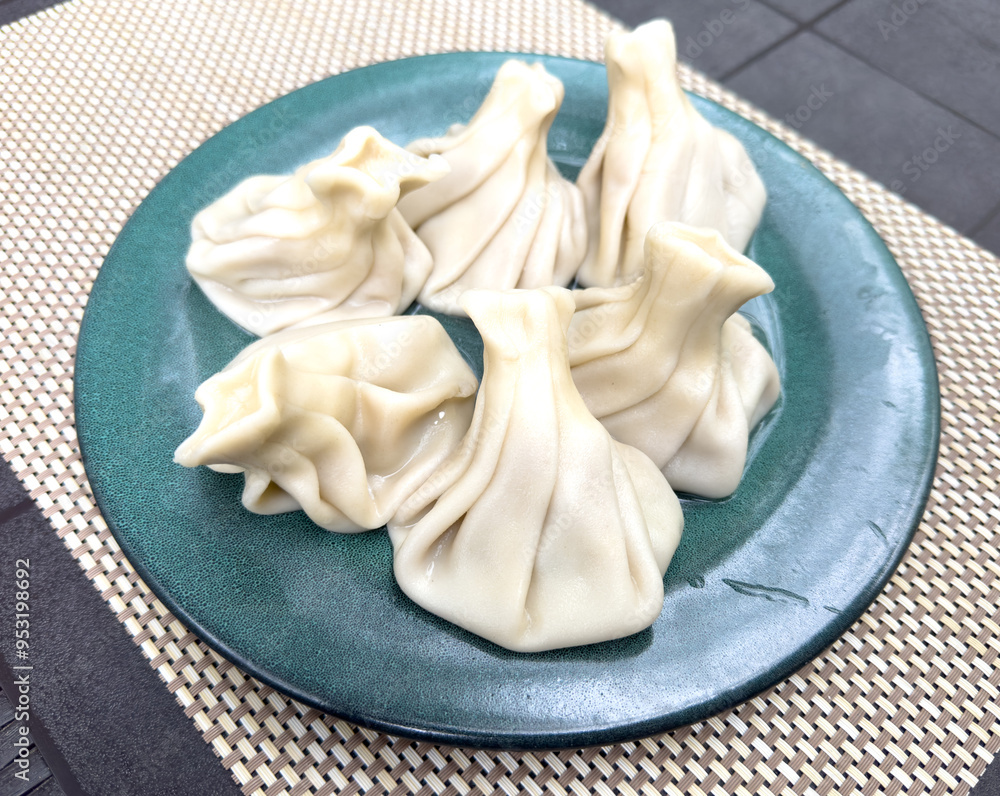 Khinkali in a plate on the table Khinkali in a plate on the table